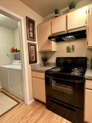 Kitchen with wooden cabinetry at The Abbey at Hightower