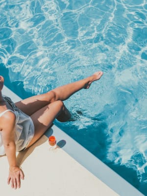 Resident dipping legs in a swimming pool at The Meridian North in Indianapolis, Indiana