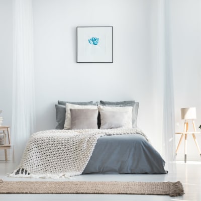 Minimalist decor in a model home's bedroom at Sofi at Topanga Canyon in Chatsworth, California