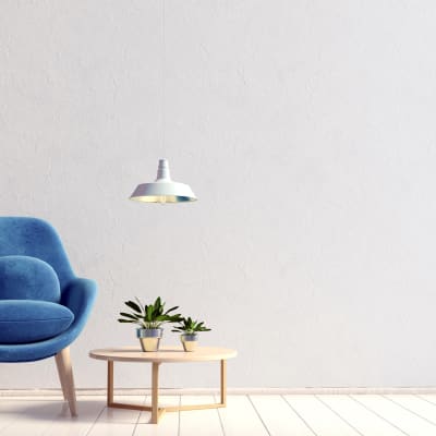 Decorative blue velvet chair with plants on an end table at Sofi Redwood Park in Redwood City, California