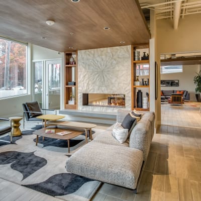 Fireplace and lounge area in the clubhouse at Verse Seattle in Seattle, Washington