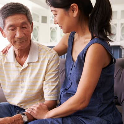 Resident talking with his adult daughter at Westminster Memory Care in Aiken, South Carolina