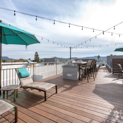 An outdoor patio area with lounge chairs at Vue at Laurel Canyon in Valley Village, California