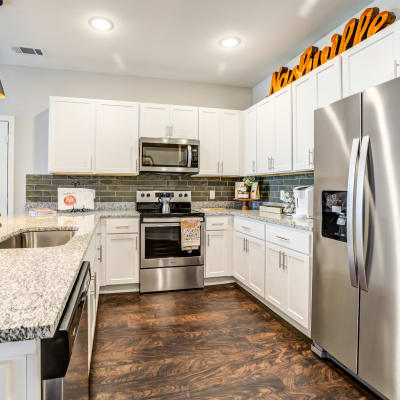 Cute dining room area with hardwood flooring at Rivertop Apartments in Nashville, Tennessee