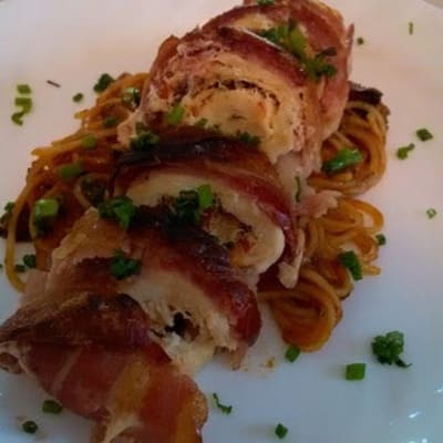 Chicken Roulade with sausage, bacon and swiss over pasta and marinara sauce at First & Main of Auburn Hills in Auburn Hills, Michigan