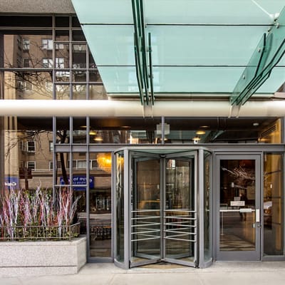 Exterior entrance with revolving doors to get in at The Ventura in New York, New York