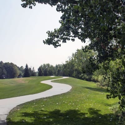 Gorgeous walkway through the scenic well kept landscape at Sofi Belmar in Lakewood, Colorado