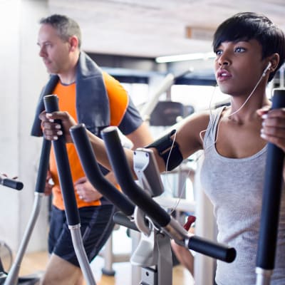 a couple of residents on ellipticals at Eucalyptus Ridge in Lakeside, California