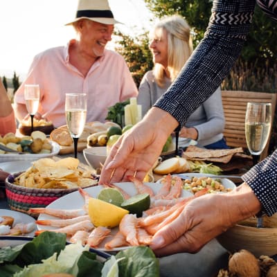 residents enjoying time outside eating dinner at Sunflower Terrace in Twentynine Palms, California