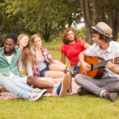 residents enjoying some sun at the park near at The Village at New Gosport in Portsmouth, Virginia