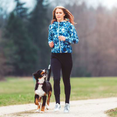 a resident running her dog at Riverview Village in Indian Head, Maryland