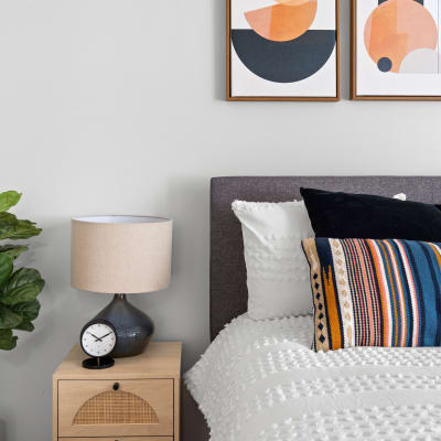 Modern bedroom with a small side table at Sofi Lyndhurst in Lyndhurst, New Jersey