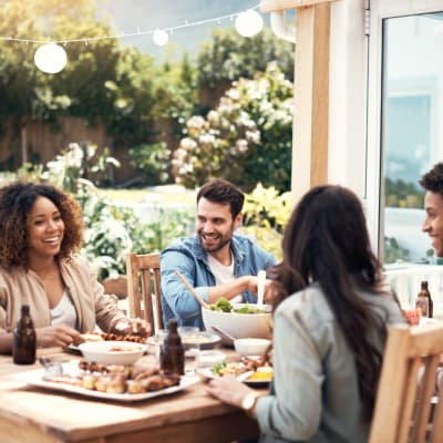 residents enjoying a meal on their patio at Ramona Vista in Ramona, California