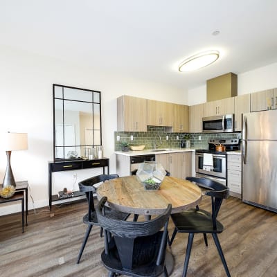 Cozy dining area next to the kitchen in a model home at Alley South Lake Union in Seattle, Washington