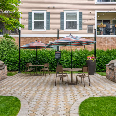 Beautifully decorated fire pit area with comfortable seating at Sofi Gaslight Commons in South Orange, New Jersey