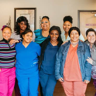 Professional caregiving team posing for a photo at 6th Ave Senior Living in Tacoma, Washington