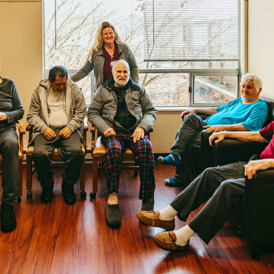 Professional caregiving team posing for a photo at Cascade Park Adult Day Health in Tacoma, Washington