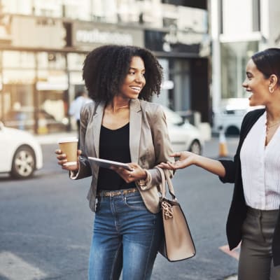 Friends grabbing a coffee and taking a stroll around town near Main Street Apartments in Rockville, Maryland