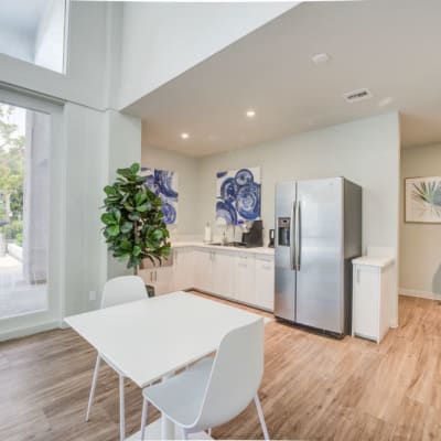 Community room with stainless steel refrigerator at The Villas at Woodland Hills in Woodland Hills, California