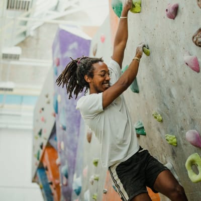 Resident going climbing at their local gym near Landmark Apartments Phase II in Little Rock, Arkansas