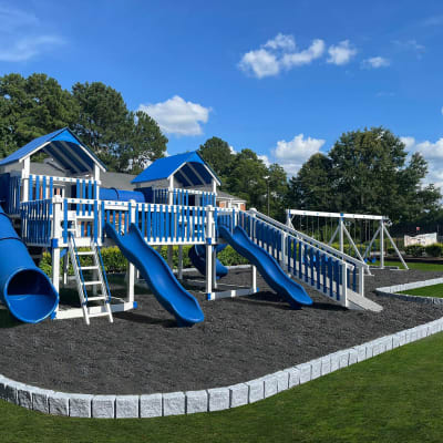 A blue and white playground at Residence at Riverside in Austell, Georgia