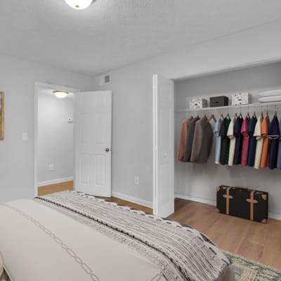 An apartment bedroom with a large closet at Residence at Riverside in Austell, Georgia