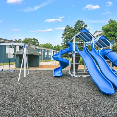 An on-site playground and swing set at Silver Creek Crossing in Austell, Georgia