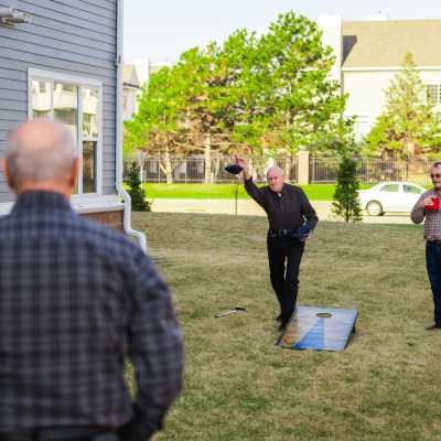 Residents playing corn hole at  Willows Bend Senior Living in Fridley, Minnesota