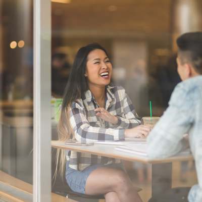 Resident drinking coffee at a cafe near Waterstone Media Center in Burbank, California