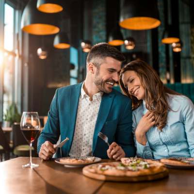 A couple having meal together at a restaurant near Wildwood Creek in Grapevine, Texas