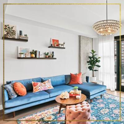 Living room with blue couch at Gentry in Atlanta, Georgia