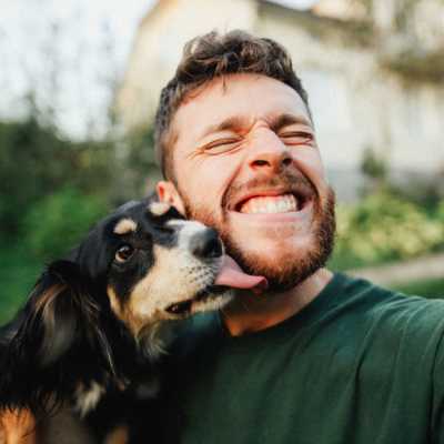 Man with little dog at The Residences at New Longview in Lee's Summit, MO