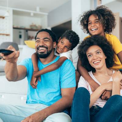 Family watching TV at The Residences at New Longview in Lee's Summit, MO