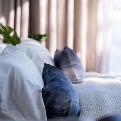 Bedroom with pillows at Sol District in Phoenix, Arizona