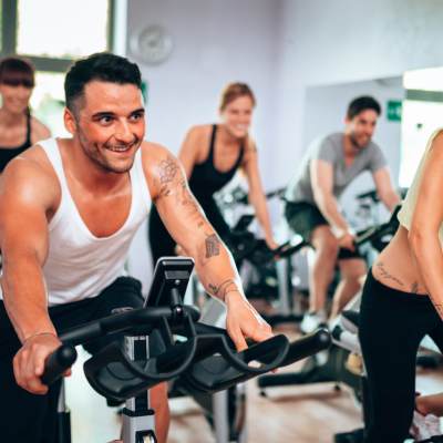 Residents cycling in the community fitness center at 544 Southern Apartments in Mesa, Arizona