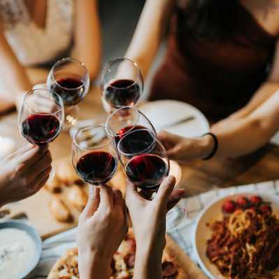 Residents toasting with drinks at Ellison in Des Plaines, IL