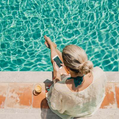 Resident by pool at The Boulevard Apartment Homes in Woodland Hills, California