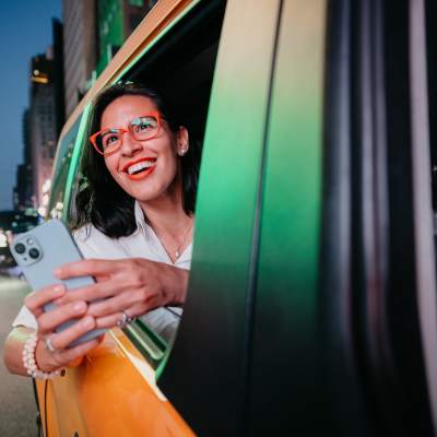 Resident smiling in the back of a cab near Exhibit On Superior in Chicago, Illinois