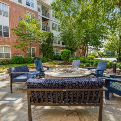 Massive lounge areas right next to the pool where you can relax and enjoy the sun at Sofi Lyndhurst in Lyndhurst, New Jersey