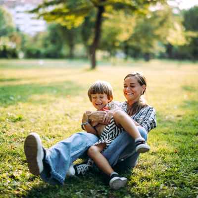 A happy mother with her child playing in the playground at Parkland Village in District Heights,Maryland
