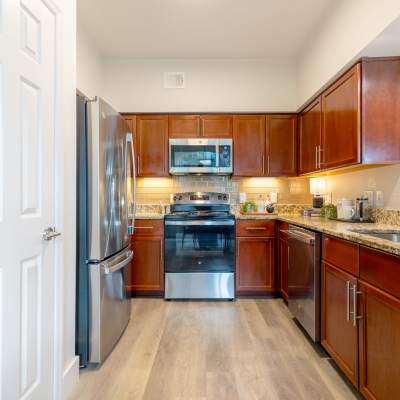 Kitchen with Granite Countertop at The Kinsley at Perimeter Center in Atlanta, Georgia