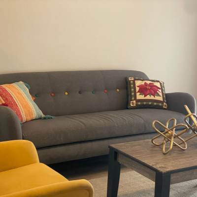 Thriving plants on a custom wood burl windowsill at Prudden Place in Lansing, Michigan