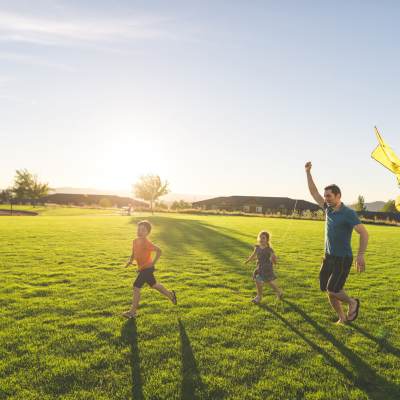 Resident family in park nearby The Residences at Creighton Waterway in North Port, Florida