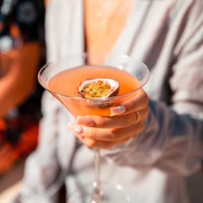 Women holding a drink in a glass near Novel Midtown in Atlanta, Georgia