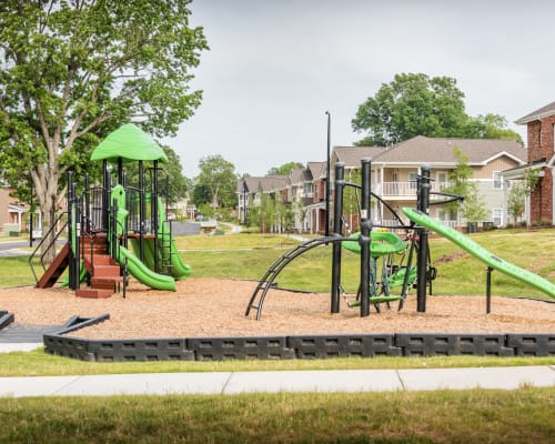 Our fun kid-welcoming playground with multiple slides and climbing structures at Brenner Crossing in Salisbury, North Carolina