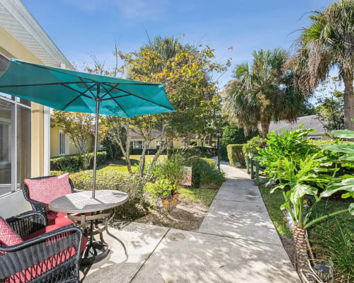 Outdoor common areas at Trustwell Living at Hunters Crossing Place in Gainesville, Florida
