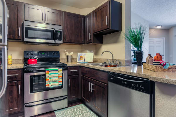 Kitchen and Living Room at Tuscany Village Apartments in Ontario