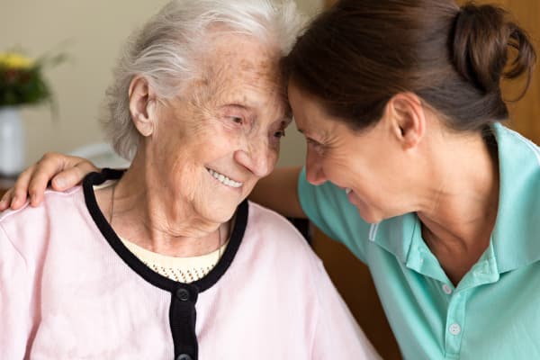 A caregiver and resident at Regency Park Senior Living, Inc.