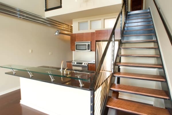 Kitchen with stainless-steel appliances at 17th Street Lofts in Atlanta, GA