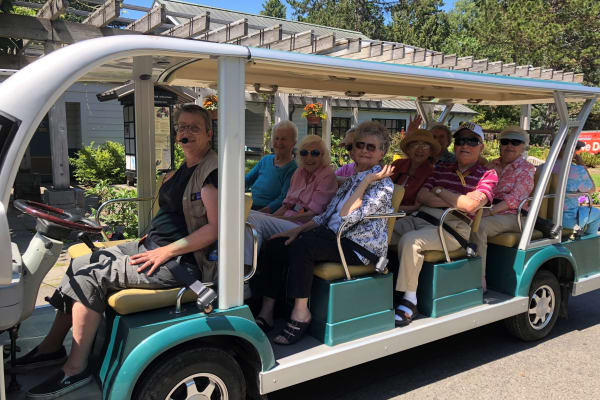 Seniors living a happy life here at Merrill Gardens at The University